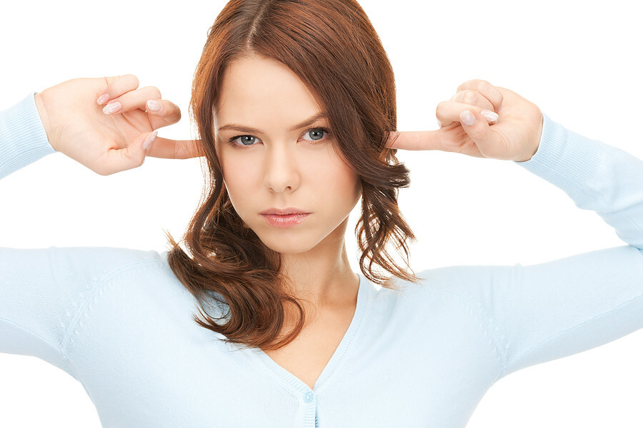 A person looking and ignoring signs, noticing pale skin and hair thinning—potential signs of nutrient deficiency.