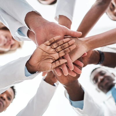 Support group meeting representing compassionate care, medical cannabis evaluations, personalized wellness, nutrition guidance, and genetic testing for medications at Bella Medical Associates.