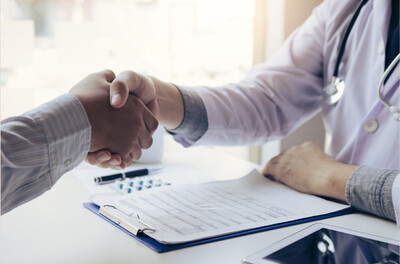 Medical provider and patient shaking hands after a qualifying medical cannabis evaluation for the Eastern Band Cherokee Indians program at Bella Medical Associates telehealth care.
