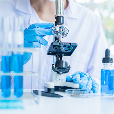 Phlebotomist handling lab tubes for functional analysis consultations and holistic health solutions to support long-term wellness at Bella Medical Associates.